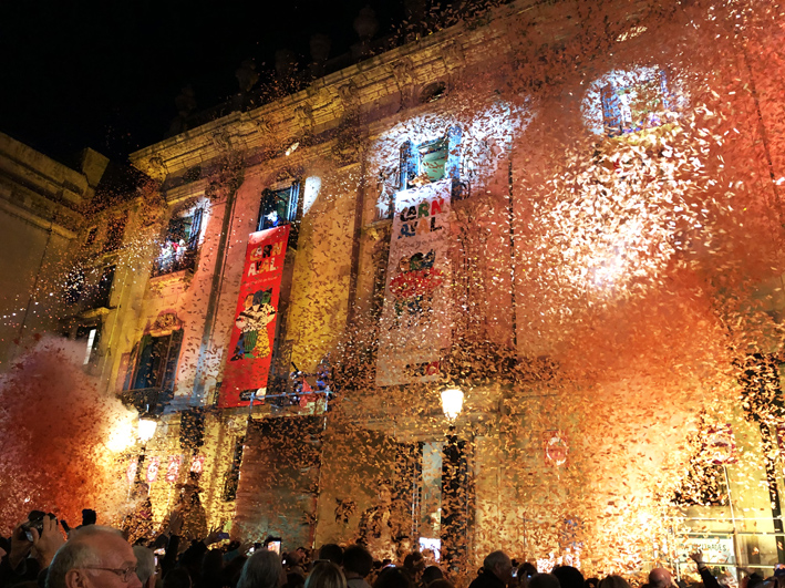 The 2020 Taronjada in front of Barcelona's La Virreina with a cloud of orange confetti