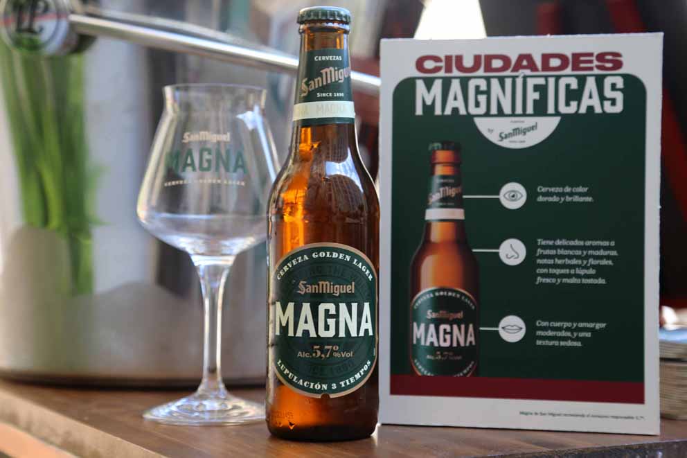 Cervezas San Miguel Magna bottle, glass and Magnificent Cities flyer